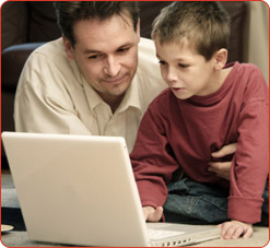 Father and Son Sitting on Carpet
